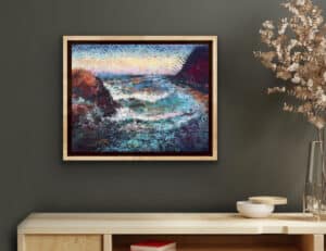 Rising Tide - Dana Point Re-Imagined by Ron Reekers displayed in a contemporary interior, showing the original mixed-media landscape in a natural wood frame.