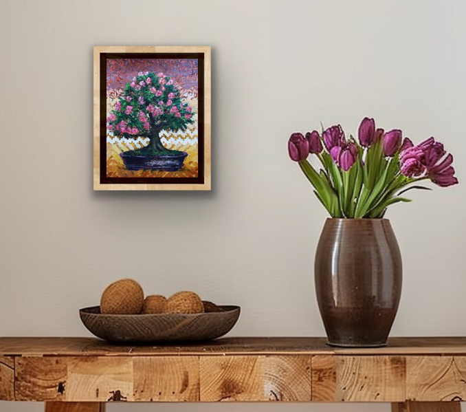 Camellia Wabisuke mixed media bonsai painting displayed framed above a wood console with purple flowers.